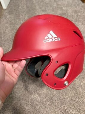 Red adidas baseball helmet